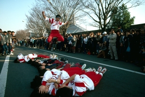 Roller skaters jump over teammates, Tokyo, Japan